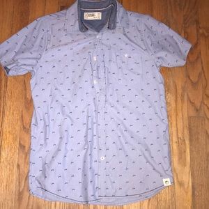 Light blue button up with little designs on it